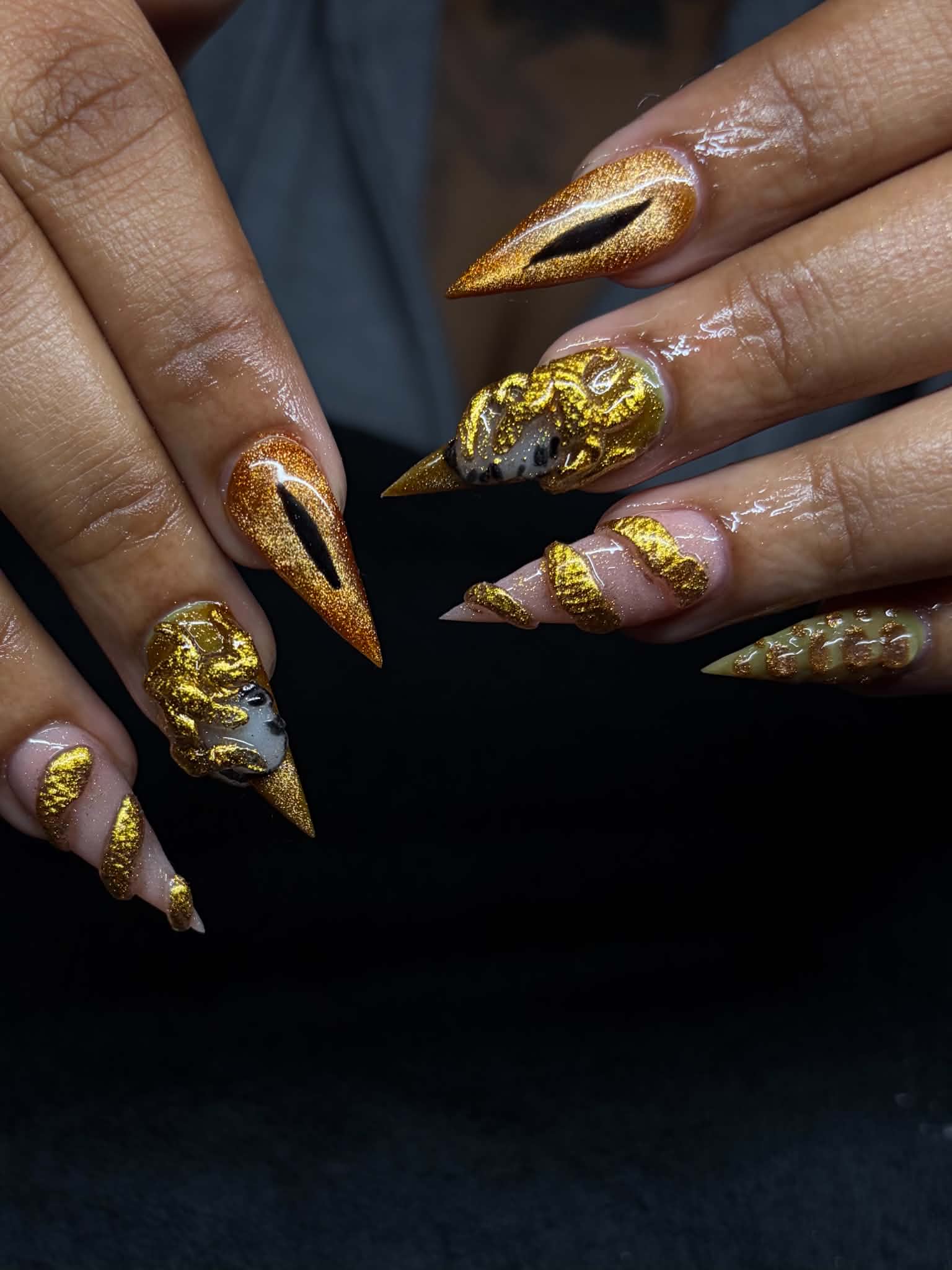 Gold accent stiletto acrylics by The Acrylic Cartel